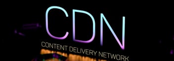 What is a CDN and how does it improve network latency?